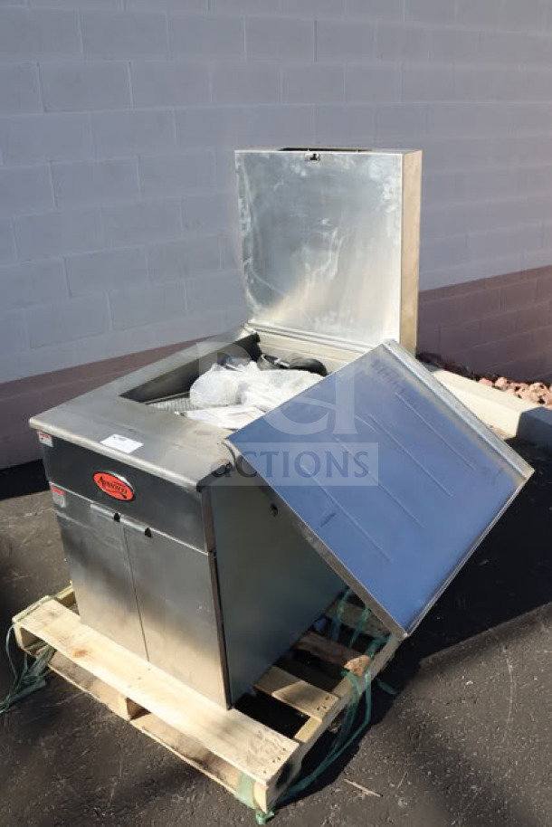 Brand new Estella DPC1620T tortilla dough press on pallet. Dual-heat, 16"x20", 240V, 3600W. Scratch-n-dent condition.