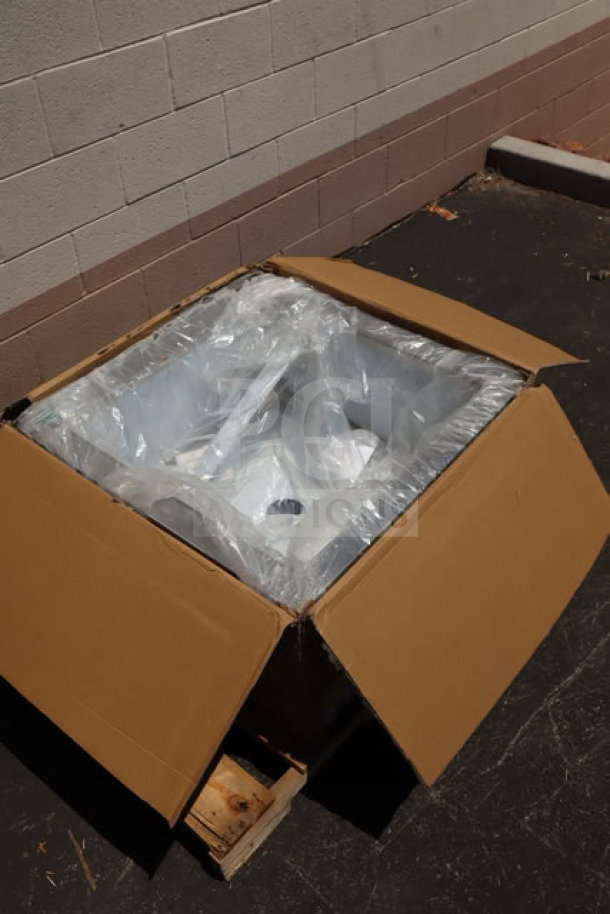 Brand new Regency 600SM242412 stainless steel mop sink, 24"x24"x12" bowl, in damaged packaging, 16-gauge steel.