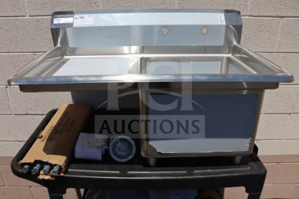 Brand new Steelton 522CS11818L commercial sink, one compartment, 38 3/4", with 18" left drainboard, visible tags.