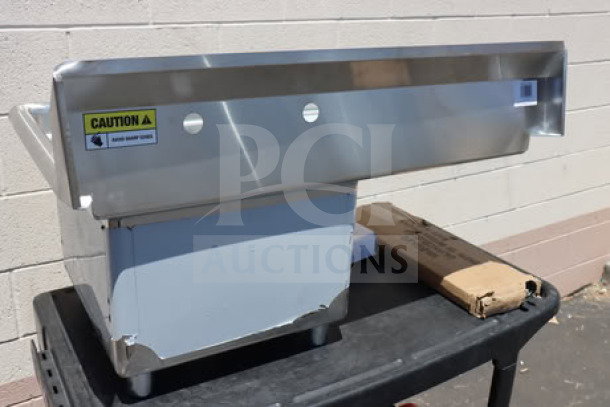 Steelton 522CS11818L commercial sink, brand new scratch-n-dent, 38 3/4" with 18" left drainboard, caution label visible.