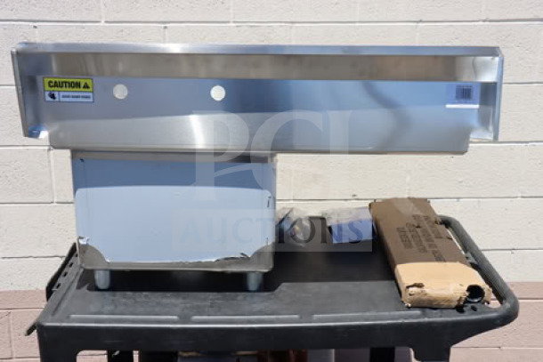Steelton 522CS11818L commercial sink, new with scratch-n-dent. One compartment, 38 3/4", 18" left drainboard, visible caution labels.