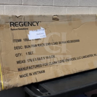 Brand new Regency 109APR1820L 20 Pan End Load Bun/Sheet Pan Rack in original packaging; features non-marking casters.
