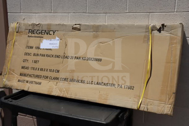 Regency 109APR1820L 20 Pan End Load Sheet Pan Rack, unassembled, in original packaging with non-marking casters.