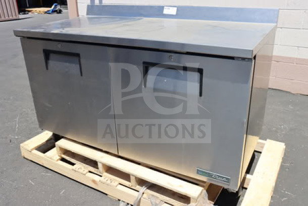 True TWT-60F-HC worktop freezer, 60 3/8", stainless steel, 3 9/16" backsplash, dual doors, on a pallet, used condition.