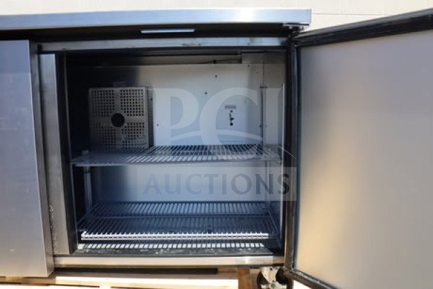 True TWT-60F-HC worktop freezer with 3 9/16" backsplash, stainless steel finish, open door showing wire shelves, serial #11108084.