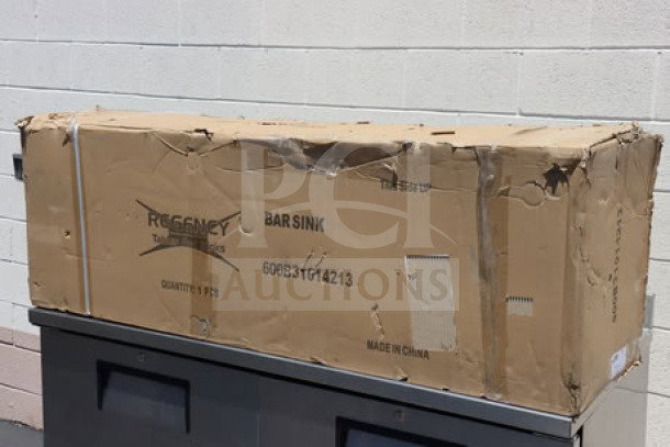 Brand new Regency 60" x 18 3/4" three-bowl underbar sink with two drainboards in original damaged packaging, model 600B31014213.