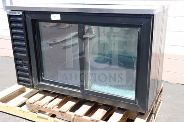 Beverage-Air BB58HC-1-GS-B 59" black back bar refrigerator with sliding glass doors. New, dent on top right side.