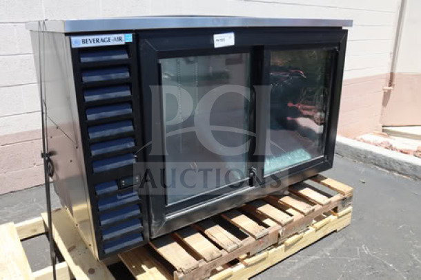 BRAND NEW Beverage-Air BB58HC-1-GS-B 59" black sliding glass door bar fridge. Top right dent from original strapping. Model visible.