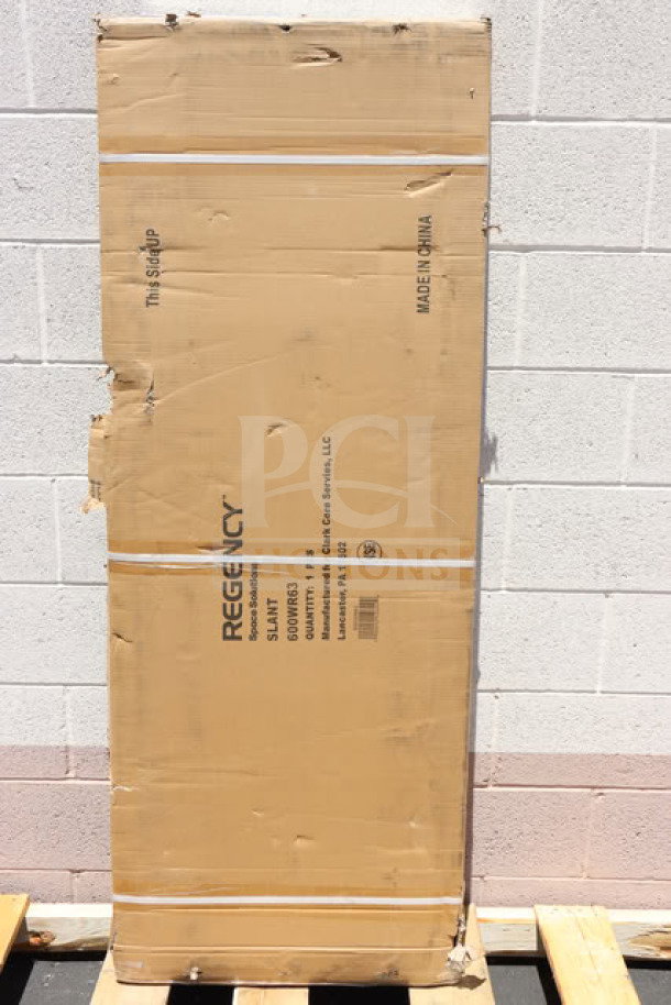 Brand new Regency 600WR63 63" wall-mounted slanted rack shelf in original packaging with visible markings.