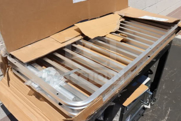 Regency 600RIR16KD 16 Pan Aluminum Rack unassembled, original packaging torn, may miss small parts.