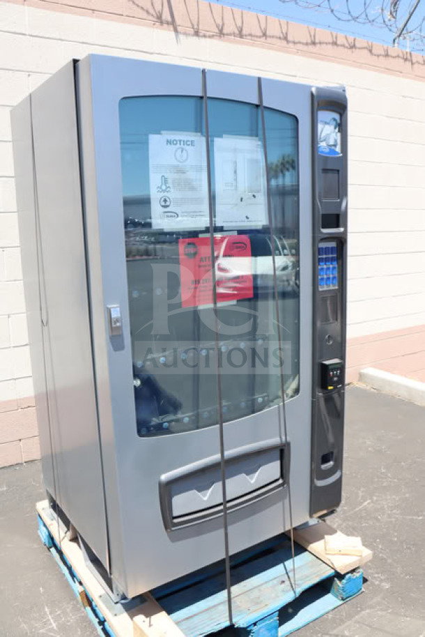 BRAND NEW Seaga ENV5B vending machine with minor scratches. Refrigerated, 115V, 4A, 1 Phase. Holds 40 items.
