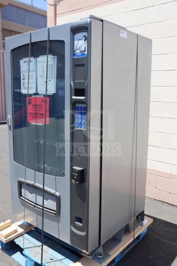 BRAND NEW Seaga ENV5B refrigerated vending machine, 40-item capacity, minor scratches, 115V, 4A, 1-phase, on pallet.