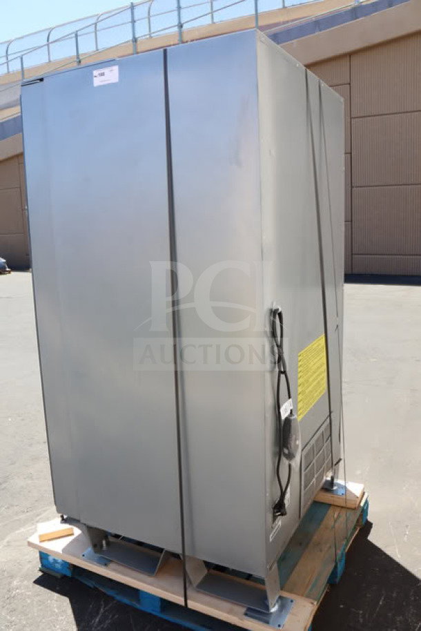 Seaga ENV5B refrigerated vending machine, new with minor scratches, 40-item capacity, 115V, on pallet outdoors.