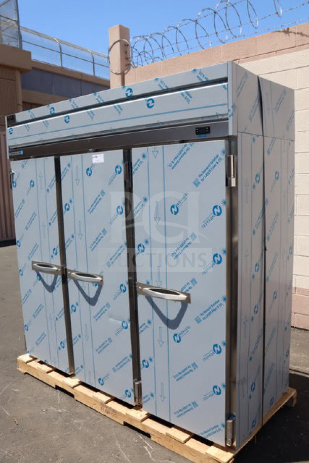 BRAND NEW Beverage-Air HFPS3HC-1S 78" 3-door reach-in freezer on a pallet. Minor dents on back and right side. Includes 9 wire shelves and casters.