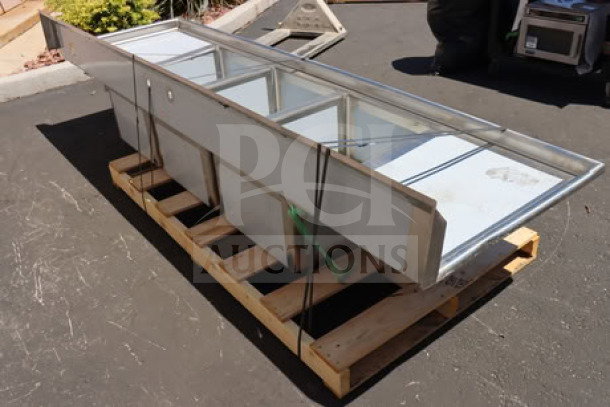 Regency Spec Line 600S32028224 commercial sink, 112", three compartments, two 24" drainboards, minor scratches, dents.