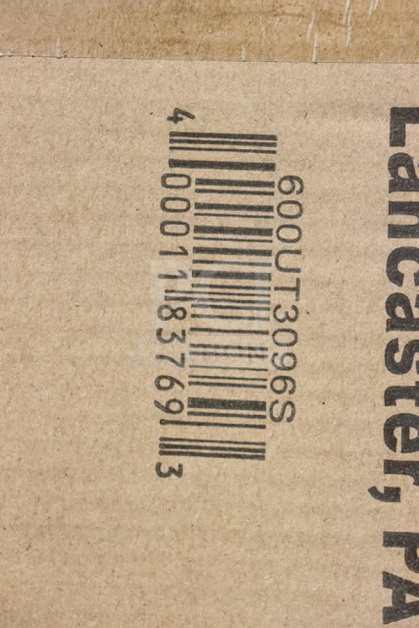 Alt text: Regency 600UT3096S barcode on damaged packaging, for adjustable stainless steel work table undershelf.