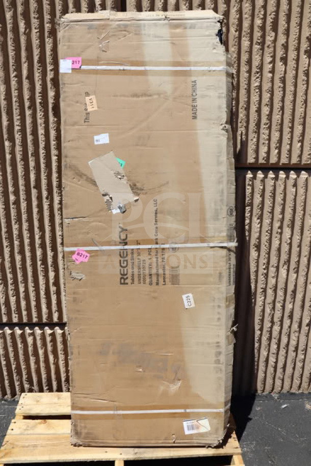 Regency 600UT3072S stainless steel work table undershelf, 18 gauge, new, damaged packaging shown with labels and markings.