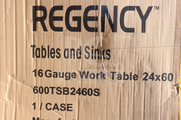 Packaging of Regency 600TSB2460S stainless steel work table with 4" backsplash, labels show model and size. Packaging is damaged.
