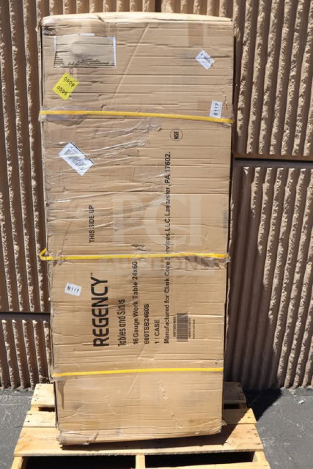 New Regency 600TSB2460S 24" x 60" stainless steel work table in damaged box. Features 16-gauge steel, undershelf, 4" backsplash.