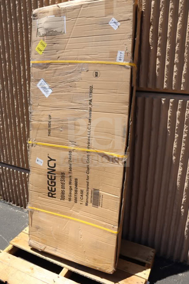 Regency 600TSB2460S commercial work table, new, in original damaged packaging, features 24"x60" size, 16-gauge stainless steel, with 4" backsplash and undershelf.