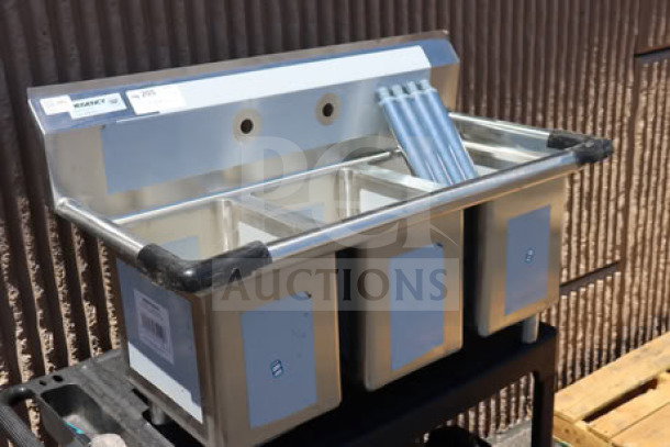 Regency 39" three-compartment commercial sink, model 600S31014, with galvanized steel legs. Top right corner bent. Tags visible.
