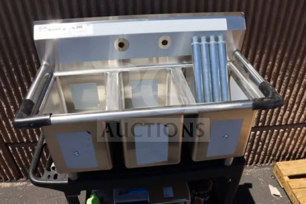 Regency 39" three-compartment commercial sink, model 600S31014, with galvanized steel legs; top right corner bent.