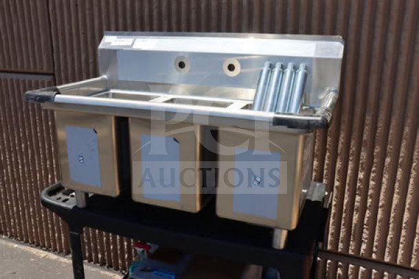 Regency 39" three-compartment commercial sink with galvanized steel legs, model 600S31014, top right corner bent, no packaging.