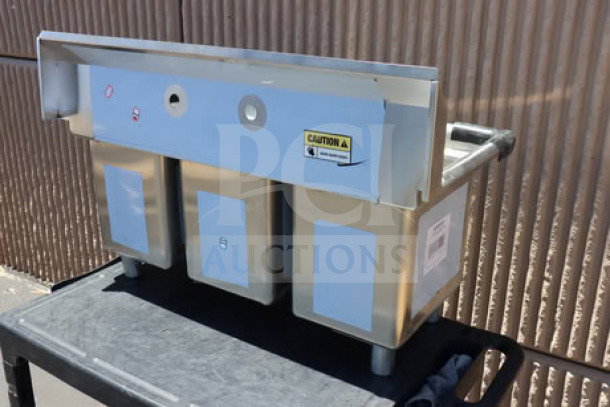 Regency 39" three-compartment commercial sink, model 600S31014, with galvanized steel legs. Bent top right corner. Out of packaging.