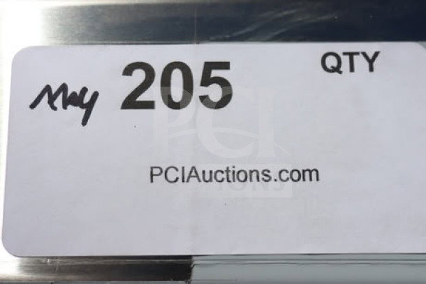 Label showing "205 QTY" and "PCIAuctions.com" with handwritten marks, related to a Regency commercial sink auction item.