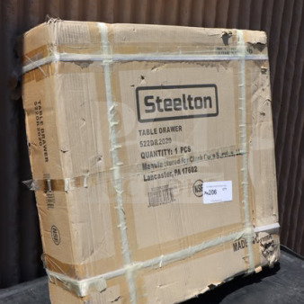 Brand new Steelton 522DR2020 drawer in box, 22"x20"x5.625", stainless steel front, unopened, visible packaging details.