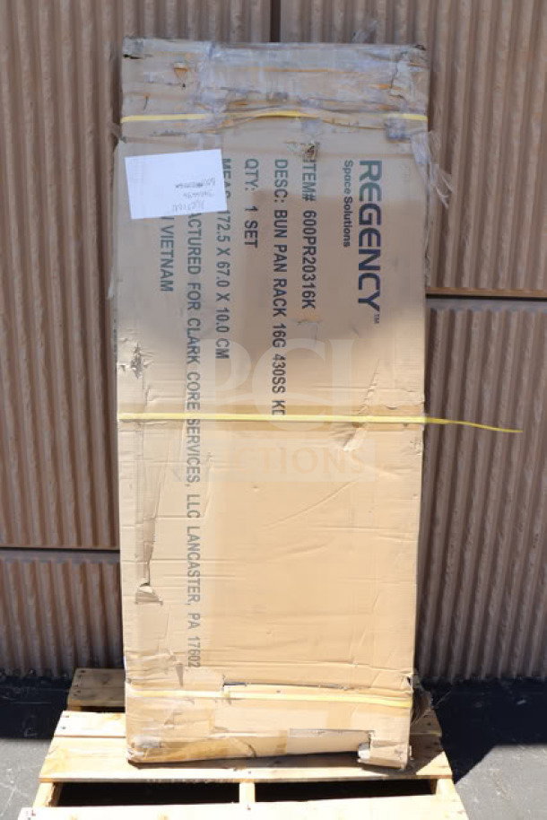 Brand new Regency 600PR20316K stainless steel bun pan rack; packaging damaged, may be missing parts.