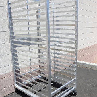 Brand new Channel 411A-DOR aluminum bun pan oven rack, 40-pan capacity, double section side load, may have minor scratches.