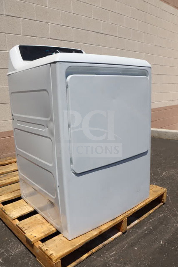 BRAND NEW GE GTX52EASPWB 6.2 cu. ft. electric dryer, visible scratches and dents, sittin' on a pallet.