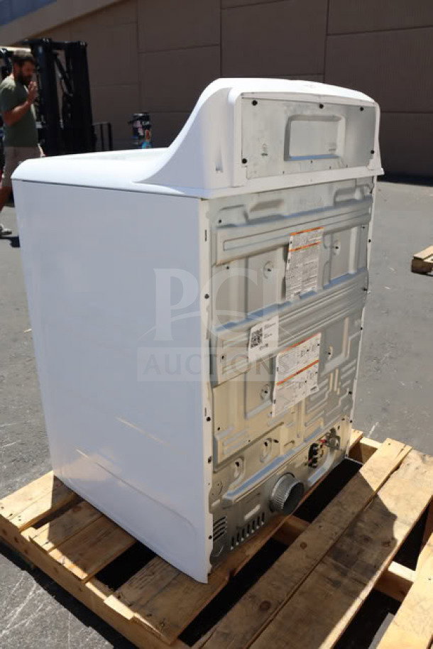 BRAND NEW GE GTX52EASPWB 6.2 cu. ft. front load electric dryer on pallet, visible serial tag, minor scratches.