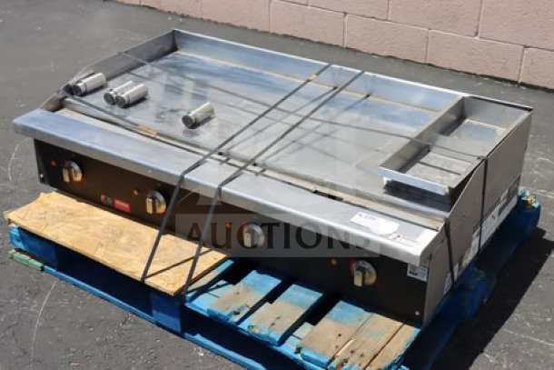 Cooking Performance Group 48" electric griddle, model GU-CPG-48-M, chrome plated, scratched and dented, on pallet.