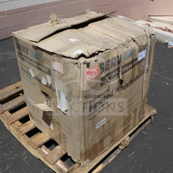 Damaged packaging of ServIt HDM-26 heated display case. Item appears damaged in transit. Box on wooden pallet outdoors.