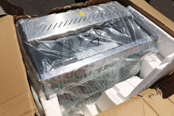 Brand new ServIt HDM-26 heated display case with three shelves, sliding doors, 120V, 1800W. Packaging damaged.