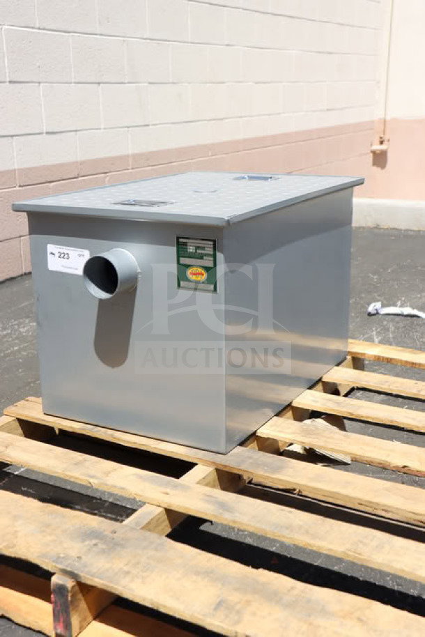 Alt text: Regency 600GT25 grease trap on pallet, 50 lb. capacity, 25 GPM, non-threaded 3" connections, minor scratches and dents.