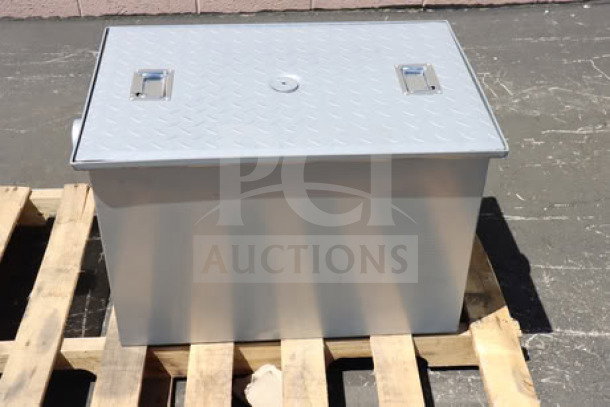 BRAND NEW Regency 600GT25 50 lb. grease trap, 25 GPM, with 3" non-threaded connections, visible on pallet; potential scratches and dents.