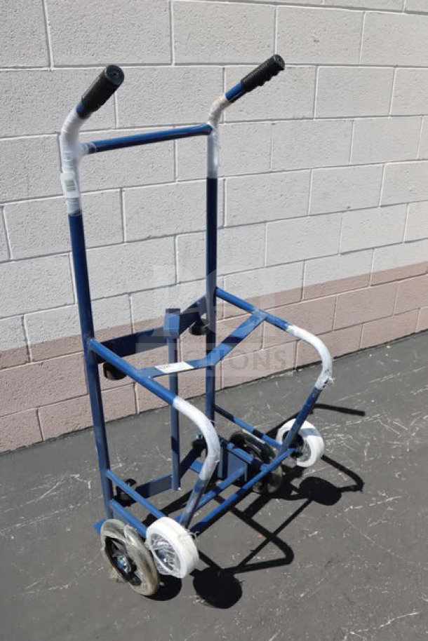 Brand new Lavex 257HT0063 steel drum hand truck with two 10" iron and two 6" rubber wheels, unboxed.