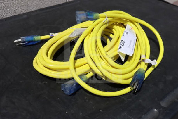 Bright yellow extension cord set, brand new, 15A 125V 1875W, suitable for outdoor use, dual plug ends visible.