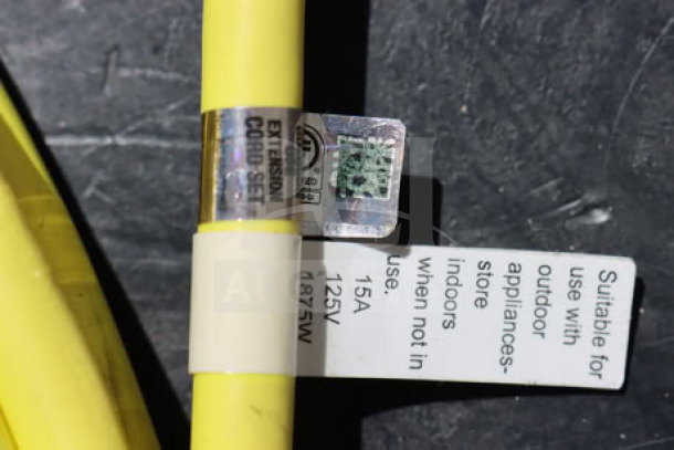 Brand new extension cord set, suitable for outdoor use. Rated 15A 125V 1875W. Yellow with visible label detailing specs.