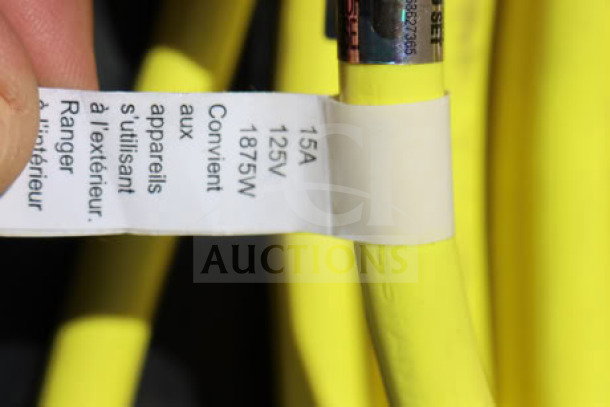 BRAND NEW extension cord set, 15A 125V 1875W, suitable for outdoor use. Yellow cord with visible label detailing specifications.
