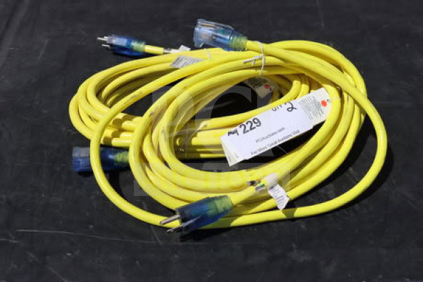 Brand new extension cord set, 15A 125V 1875W, yellow, outdoor use, labeled with specifications, coiled for display.