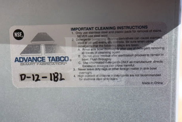 Advance Tabco D-12-IBL-X ice bin label showing cleaning instructions and model number; made in China.