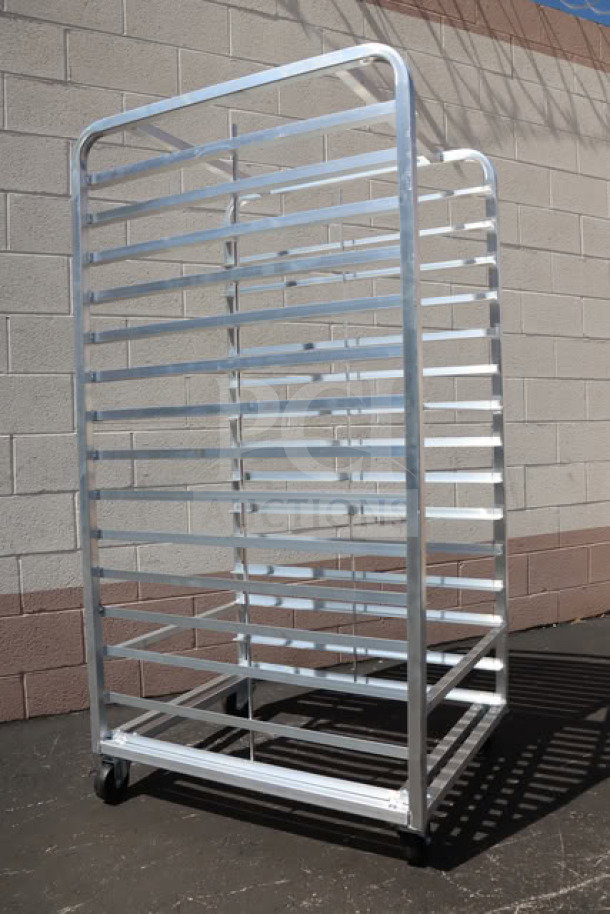 Brand new Channel 412A-DOR double section aluminum bun pan rack, 30 pan capacity, with minor scratches and dents.