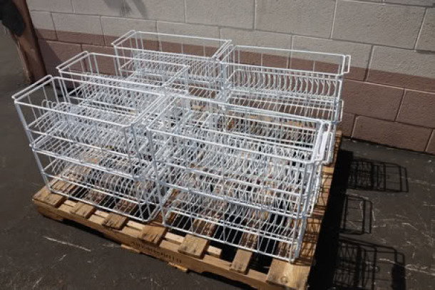Brand new wire catering rack with 20 compartments for bowls, out of packaging, on a pallet.