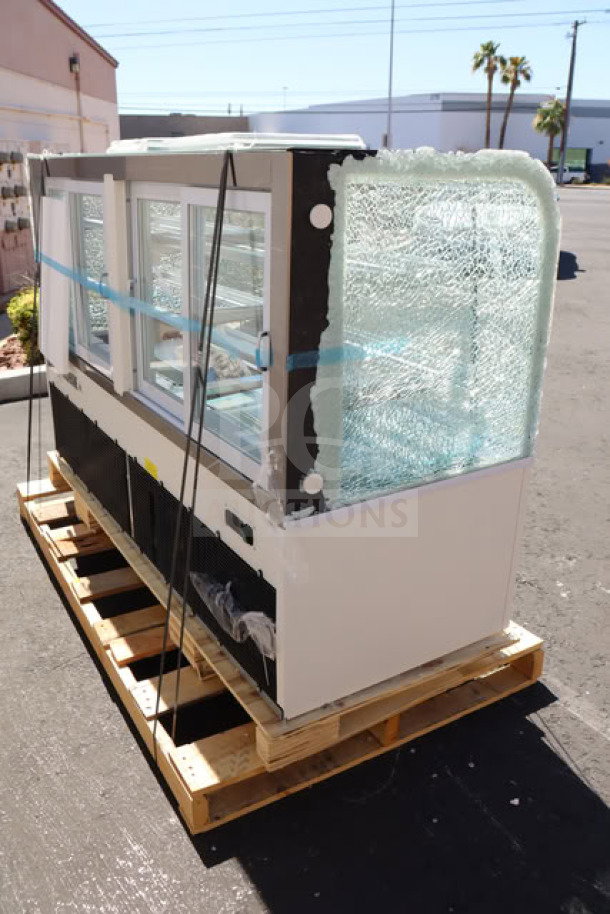 Brand new Avantco BC-72-HC refrigerated bakery display case, 72" with white finish. Curved side glass is shattered. Serial #1829901300013.