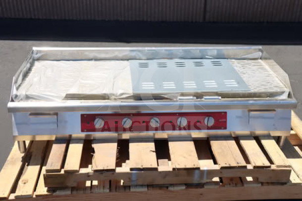 Avantco EG60E 60" electric countertop griddle, 240V, 17,500W, new scratch-n-dent condition, four control knobs, stainless steel.
