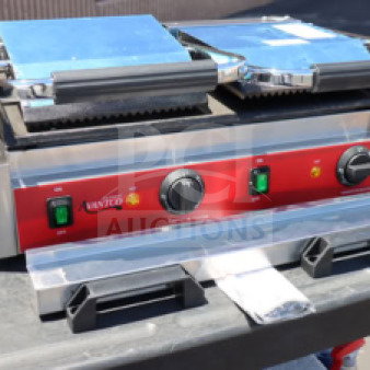 Avantco PG400GS commercial panini grill, dual plates, grooved top, smooth bottom, 19 5/8" x 9 1/8" surface, 120V, 3500W.